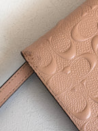 Coach Dusty Rose Pink Embossed Logo Anna Foldover Crossbody Bag