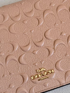 Coach Dusty Rose Pink Embossed Logo Anna Foldover Crossbody Bag
