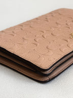 Coach Dusty Rose Pink Embossed Logo Anna Foldover Crossbody Bag