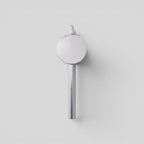 ESTYNE Studio Studio Sconce in brushed stainless steel with a minimalist circular design for modern wall lighting.