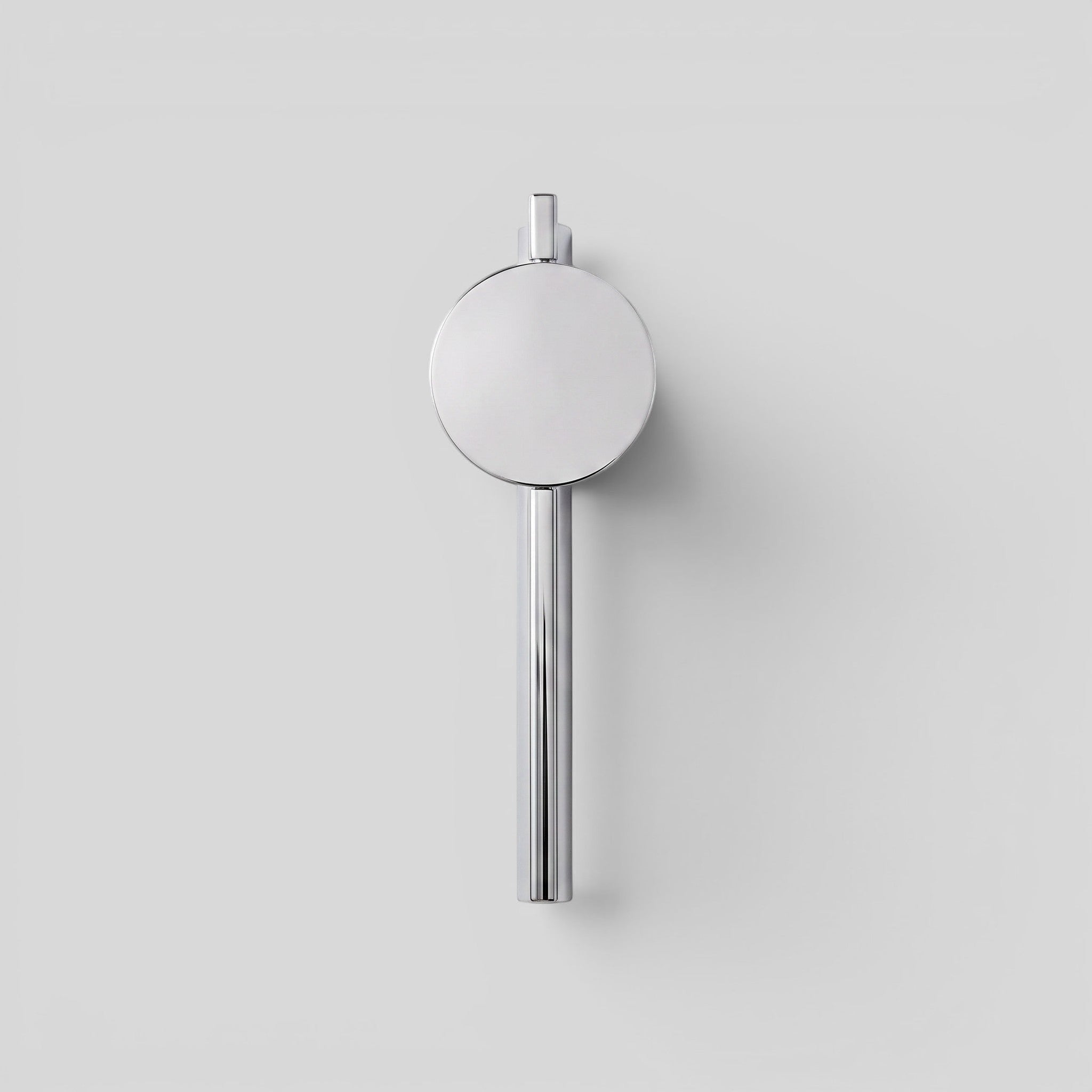 ESTYNE Studio Studio Sconce in brushed stainless steel with a minimalist circular design for modern wall lighting.