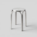 BY–EA Studio Stool in polished stainless steel with a minimalist, stackable industrial design for modern interiors.