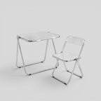 ESTYNE Studio folding chair and table set with transparent acrylic seats and polished chrome frames.